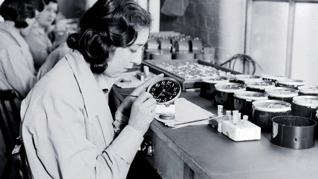One of the radium girls painting a watch face